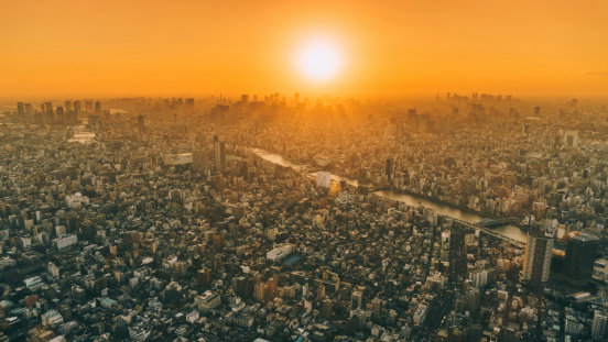 The sun over a city.